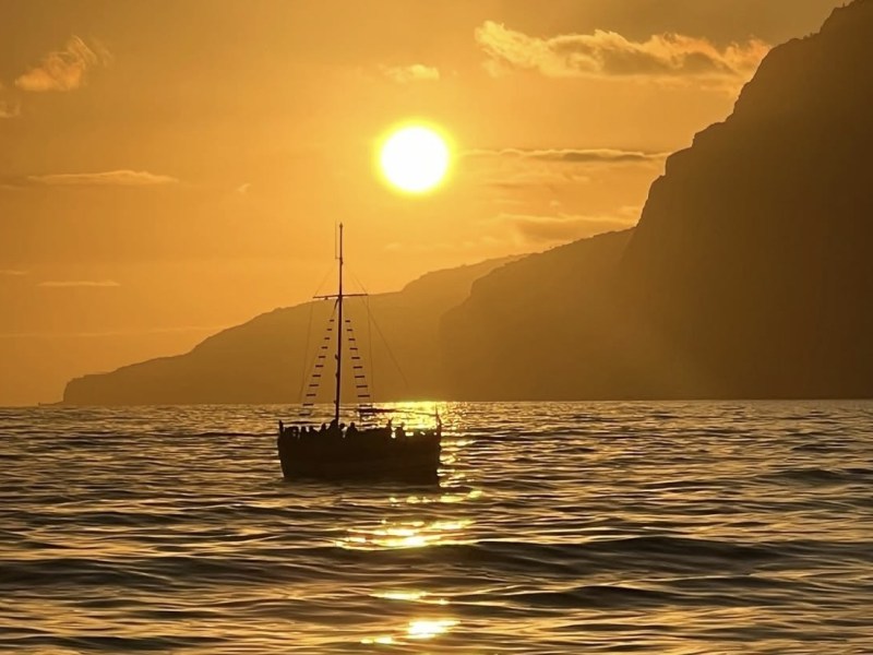 a sunset over a body of water