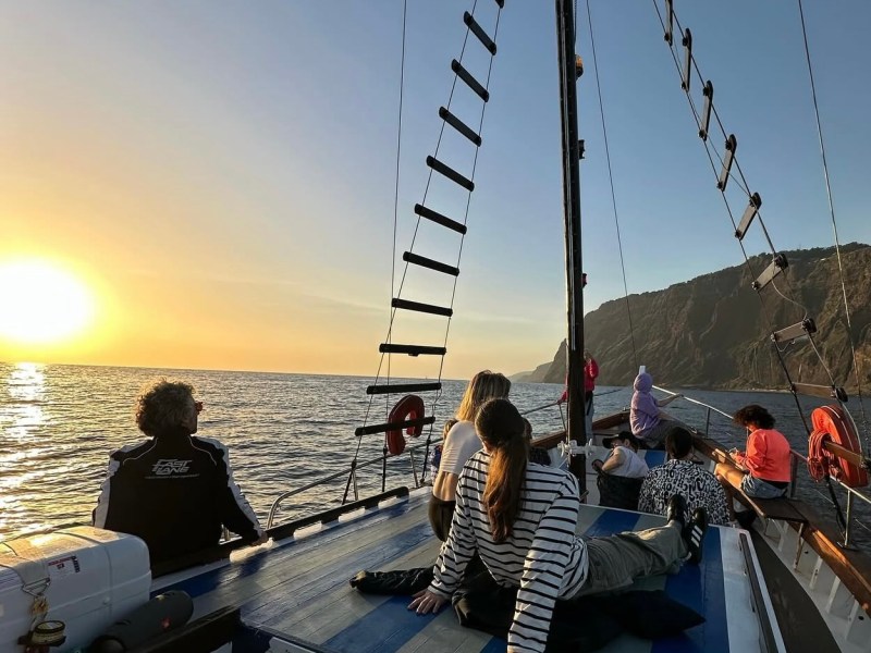 a group of people in a boat on a body of water