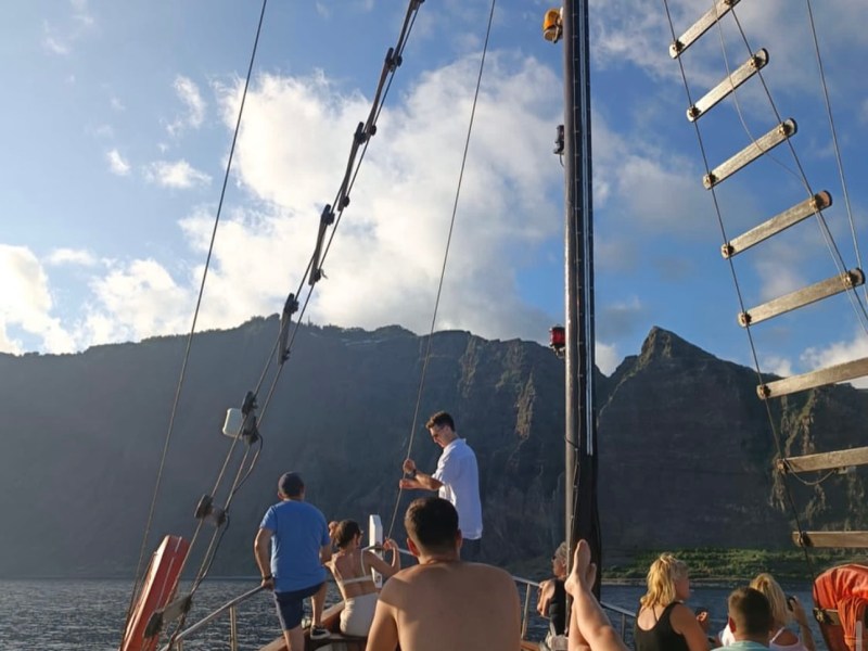 a group of people on a boat in the water